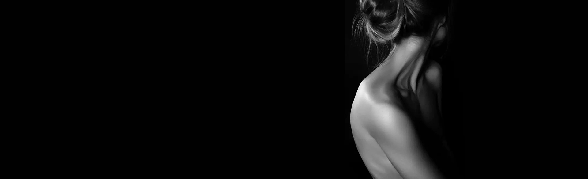 A black and white photo of a woman's back showcasing the impressive transformation through Bodytite Before and After Photos.