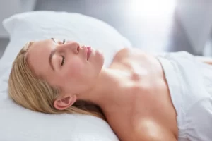 a woman sleeping on her back