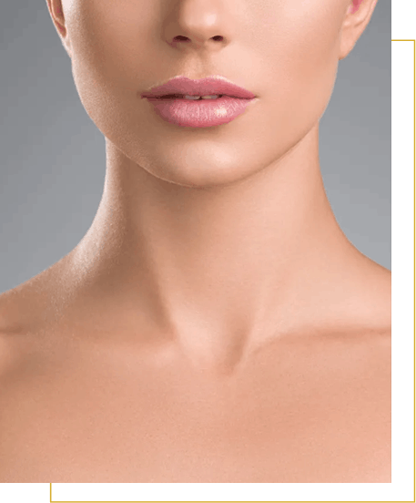 Close-up of a woman's lower face, neck, and shoulders against a neutral gray background. The skin appears smooth and the lips are slightly parted.