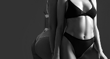 Two women wearing black bikinis are standing side by side against a plain dark background in a black and white photo.