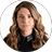 Portrait of a person with long, wavy hair, wearing a dark collared shirt, pictured against a plain white background—a perfect study for those wanting to Practice their portrait skills.