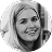 Black and white headshot of a smiling young woman with straight, light-colored hair, reflecting the welcoming spirit of Our Practice.